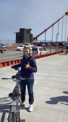 Jane Criminger Johnson after biking across the Golden Gate Bridge with Layton Long. Just before the tire blew out.